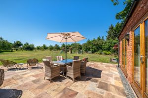 Paved Patio Seating Area & Gardens- click for photo gallery
